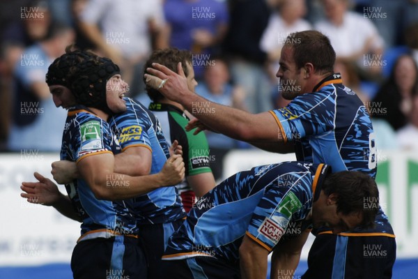 10.10.09 Cardiff Blues v Harlequins - Heineken Cup - Cardiff Blues' Leigh Halfpenny celebrates his try with team mates. 