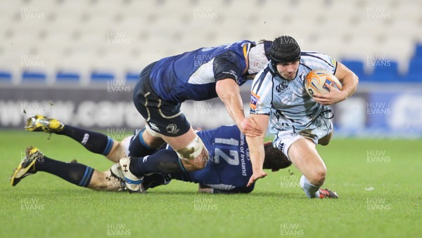 07.11.12 Cardiff Blues v Leinster... Blues' Leigh Halfpenny is tackled by Leinster's Gordon Darcy and Devin Toner. 