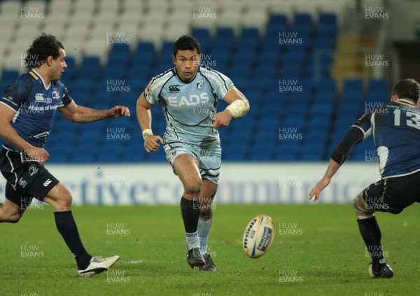 07.01.12 Cardiff Blues v Leinster - RaboDirect PRO 12 - Blues' Casey Laulala chips the ball between Leinster's Isa Nacewa(L) and Fergus McFadden 