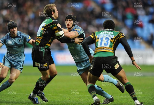 28.03.09 - Cardiff Blues v Northampton - EDF Energy Cup Semi Final 2009 - Cardiff's Tom James is tackled by Northampton's Stephen Myler. 