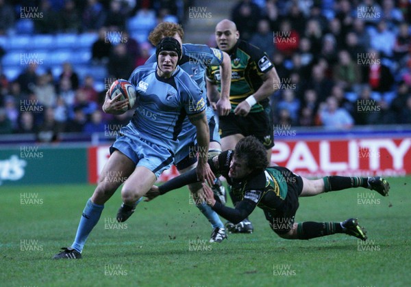 28.03.09...Cardiff Blues v Northampton... Blues Tom James beats tackle by Lee Dickson.. 