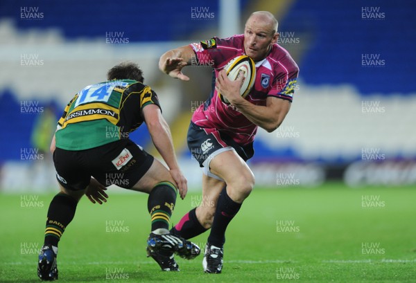 28.08.09 - Cardiff Blues v Northampton Saints - Pre-Season Friendly - Gareth Thomas of Cardiff Blues takes on Paul Diggin of Northampton. 