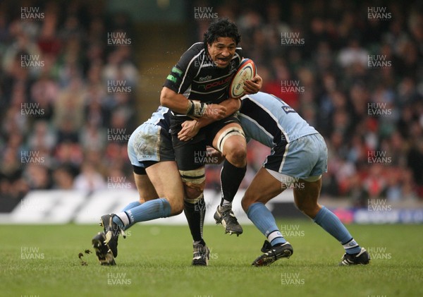 24.03.07 Cardiff Blues v Ospreys Ospreys Filogia Tiatia is tackled by Tom james and Marc Stcherbina 