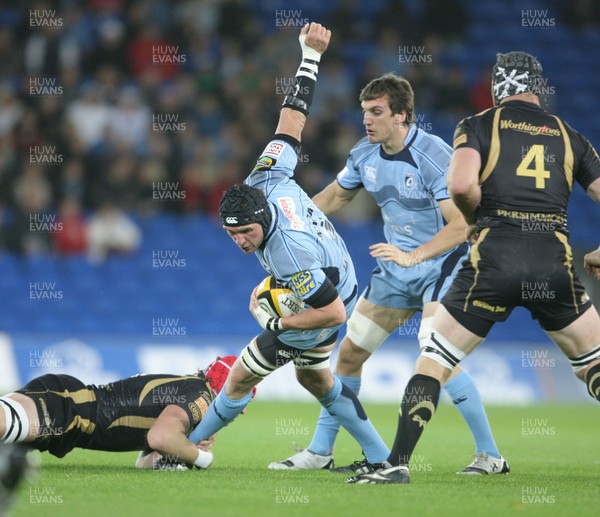 24.10.09 Blues v Ospreys... Blues' Scott Morgan is tackled by Ospreys' Alun-Wyn Jones. 