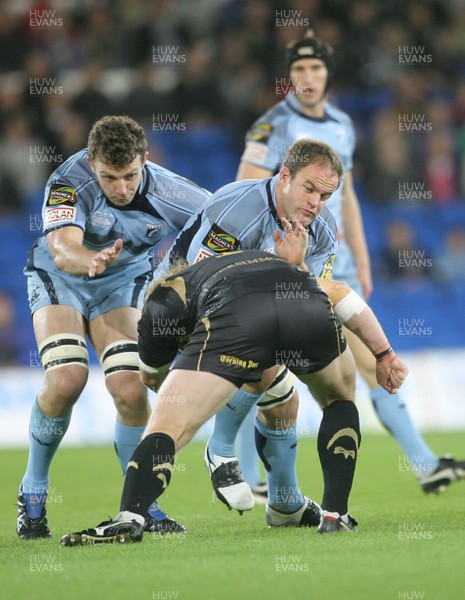 24.10.09 Blues v Ospreys... Blues' Xavier Rush is tackled by Duncan Jones. 