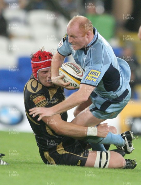 24.10.09 Blues v Ospreys... Blues' Martyn  Williams is tackled by Ospreys' Alun-Wyn Jones. 