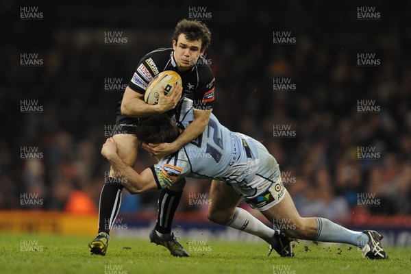 300313 - Cardiff Blues v Ospreys - RaboDirect PRO12 - Tom Habberfield of Ospreys is tackled by Dafydd Hewitt of Cardiff Blues 