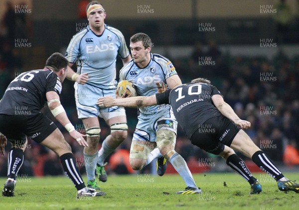 300313 Cardiff Blues v Ospreys - RaboDirectPro12 -Blues' Sam Warburton takes on Ospreys' Dan Biggar(10) and Scott Baldwin