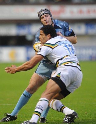 29.08.08 - cardiff Blues v Northampton Saints Blues' Roger Davies is tackled by Joe Ansbro 