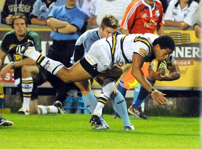 29.08.08 - cardiff Blues v Northampton Saints Northampton's Joe Ansbro is brought down 