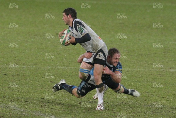 16.01.10. Cardiff Blues v Sale Sharks... Sale Sharks' Nick MacLeod is tackled by Cardiff Blues' Xavier Rush. 