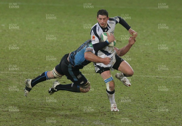 16.01.10. Cardiff Blues v Sale Sharks... Sale Sharks' Nick MacLeod is tackled by Cardiff Blues' Xavier Rush. 