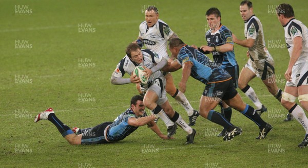 16.01.10. Cardiff Blues v Sale Sharks... Sale Sharks' Mathew Tait is tackled by Cardiff's Jamie Roberts(lt) and Taufau Filise. 