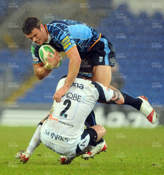 15.01.10 - Heineken Cup Rugby, Group 5, Cardiff Blues v Sale Sharks Cardiff Blues' Jamie Roberts is tackled by Sale Sharks' Neil Briggs 