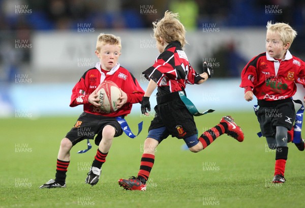 22.10.10.. Cardiff Blues v Scarlets, Magners League. Action from half-time Tag match between Dowlais RFC (red and black) and Llantwit Major RFC             