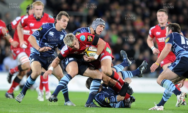 22.10.10 - Cardiff Blues v Scarlets - Magners League - Gareth Maule of Scarlets is tackled by Ceri Sweeney of Blues. 