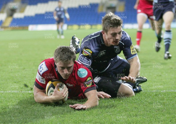 22.10.10 Cardiff Blues v Llanelli Scarlets - Magners League -  Scarlets' Rhys Priestland dives over to score a try.  