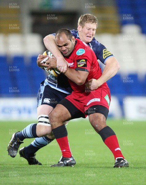 22.10.10.. Cardiff Blues v Scarlets, Magners League -  Scarlets' Deacon Manu is held by Cardiff Blues' Bradley Davies 