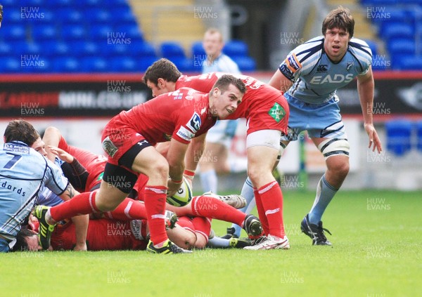 23.10.11 Cardiff Blues v Scarlets - LV=Cup - Scarlets' Gareth Davies feeds the ball out from the bottom of a ruck 