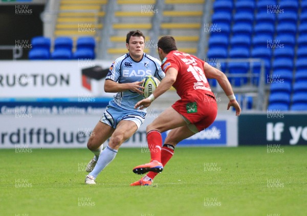 23.10.11 Cardiff Blues v Scarlets - LV=Cup - Blues' Adam Thomas takes on Scarlets' Sean Lamont 