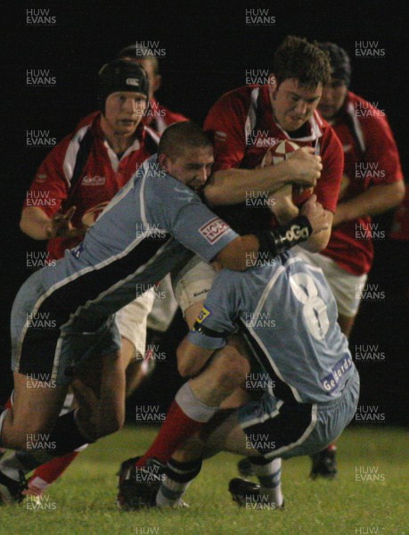 26.09.07 Cardiff Blues Clubs XV vs. Llanelli Scarlets Clubs XV. Abercynon RFC. 
 
Llewellin Evans is halted by BLues' back-rowers Marcus Caudle(L) & Martin Williams(8). 
 
Darren Griffiths/