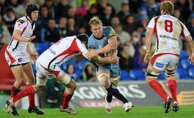 26.03.10 - Magners League Rugby, Cardiff Blues v Ulster Rugby Blues' Andy Powell is tackled by Ryan Caldwell. 