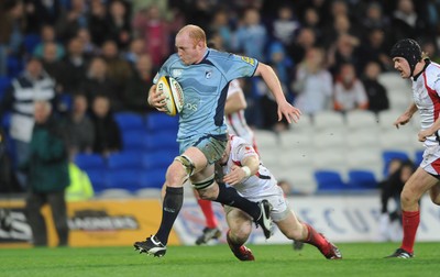 26.03.10 - Cardiff Blues v Ulster - Magners League - Blues' Martyn Williams is tackled by Ulster's Darren Cave. 