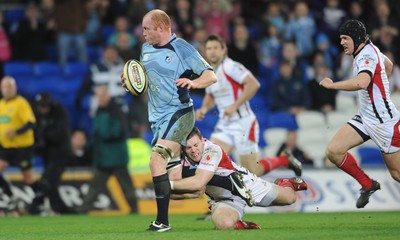 26.03.10 - Cardiff Blues v Ulster - Magners League - Blues' Martyn Williams is tackled by Ulster's Darren Cave. 