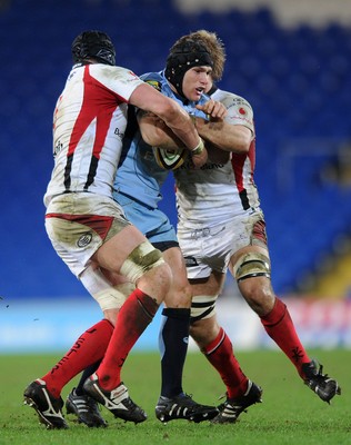 26.03.10 - Cardiff Blues v Ulster - Magners League - Blues' Tom James is tackled by Ulster's Dan Tuohy and Chris Henry. 