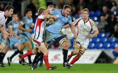 26.03.10 - Cardiff Blues v Ulster - Magners League - Blues' Xavier Rush is tackled by Ulster's Paul Marshall. 