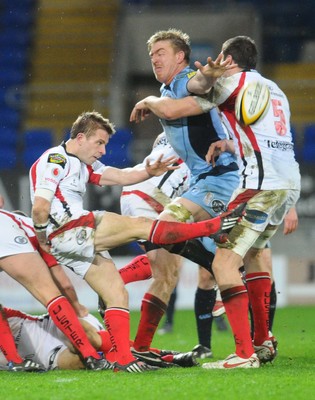 26.03.10 - Magners League Rugby, Cardiff Blues v Ulster Rugby Ulster's Paul Marshall clears as Blues' Andy Powell challenges 