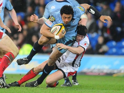 26.03.10 - Magners League Rugby, Cardiff Blues v Ulster Rugby Blues' Casey Lualalais tackled by Ulster's Niall O'Connor 