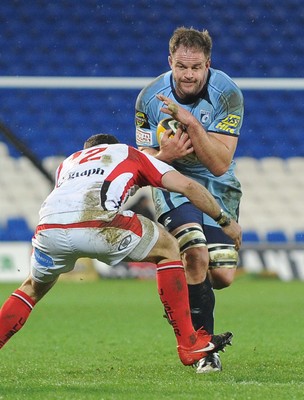 26.03.10 - Magners League Rugby, Cardiff Blues v Ulster Rugby Blues' Xavier Rush is tackled by Ulster's Paddy Wallace 