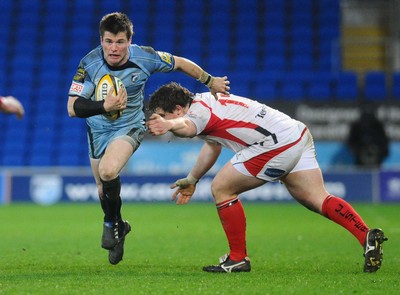 26.03.10 - Magners League Rugby, Cardiff Blues v Ulster Rugby Blues' Ceri Sweeney gets past Ulster's Declan Fitzpatrick 