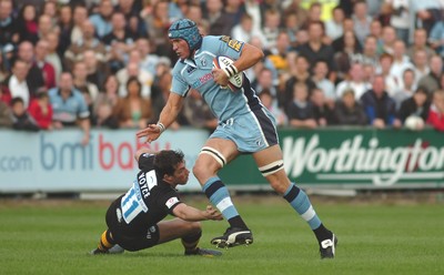 300906 - Cardiff Blues v London Wasps - EDF Energy Cup - Cardiff Arms Park - Cardiff Blues' Scott Morgan tries to get past Tom Voyce 