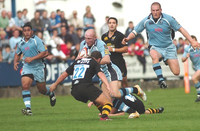 300906 - Cardiff Blues v London Wasps - EDF Energy Cup - Cardiff Arms Park - Cardiff Blues' Tom shanklin takes on James Brooks 