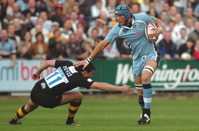 300906 - Cardiff Blues v London Wasps - EDF Energy Cup - Cardiff Arms Park - Cardiff Blues' Scott Morgan tries to get past Tom Voyce 