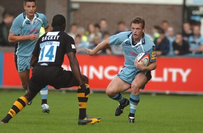 300906 - Cardiff Blues v London Wasps - EDF Energy Cup - Cardiff Arms Park - Blues' Ben Blair takes on Paul Sackey 