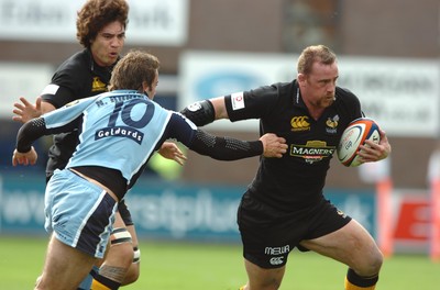 300906  Cardiff Blues v Wasps  Joe Ward is tackled by Nicky Robinson  