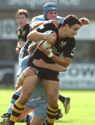 300906  Cardiff Blues v Wasps  Wasps Jeremy Staunton is tackled by Rhys Thomas and Scott Morgan  