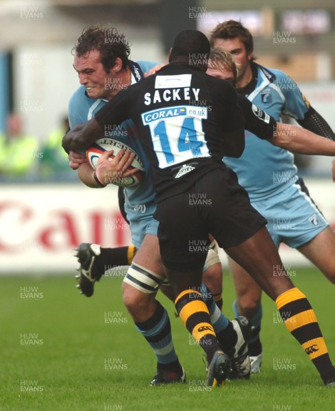 300906 - Cardiff Blues v London Wasps - EDF Energy Cup - Cardiff Arms Park - Cardiff Blues' Robert Sidoli is tackled by Paul Sackey 