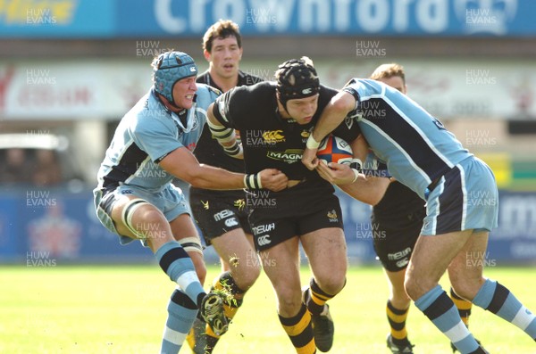 300906  Cardiff Blues v Wasps  Wasps James Haskell  is tackled by Mike Phillips and Scott Morgan  