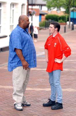 020703 - Kyoni! Ho Gaya Na Pyar (Love Has Finally Happened) Filming - Neath resident Wes Dazely (rt) chats to Cam from the Bollywood film crew in Neath town centre