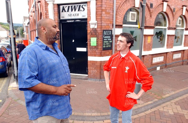 020703 - Kyoni! Ho Gaya Na Pyar (Love Has Finally Happened) Filming - Neath resident Wes Dazely (rt) chats to Cam from the Bollywood film crew in Neath town centre