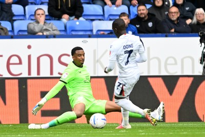 120926 - Bolton Wanderers v Cardiff City - Sky Bet Championship - Nathan Trott of Cardiff City makes the challenge on Kyliane Dong of Bolton