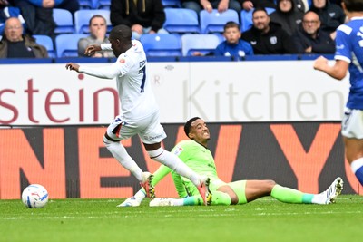 120926 - Bolton Wanderers v Cardiff City - Sky Bet Championship - Nathan Trott of Cardiff City makes the challenge on Kyliane Dong of Bolton