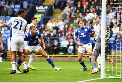 120926 - Bolton Wanderers v Cardiff City - Sky Bet Championship - Krystian Bielik of Cardiff City heads a shot at Gavin Bazunu of Bolton