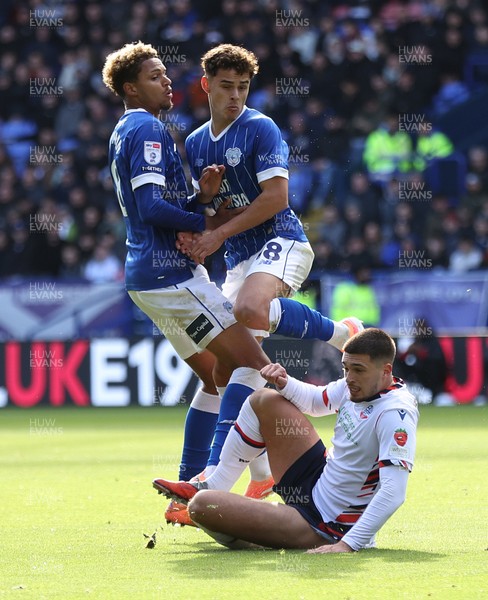 251025 - Bolton Wanderers v Cardiff City - Sky Bet League 1 - Omari Kellyman of Cardiff and Alex Robertson of Cardiff try to get the ball from Xavier Simons of Bolton but end up colliding with each other