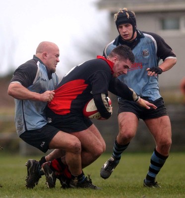 080203 - Bonymaen v Cardiff - Principality Cup - Bonymaen's Andrew Llewellyn is brought down by Dan Baugh and Robin Sowden-Taylor 