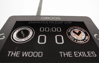 071225 - Boreham Wood v Newport County, Emirates FA Cup 2nd Round - The scoreboard ahead of the match